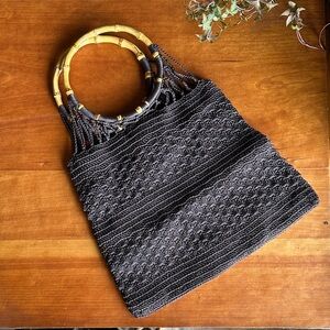 VNTG boho brown macrame/woven handbag with round bamboo ring handles.
